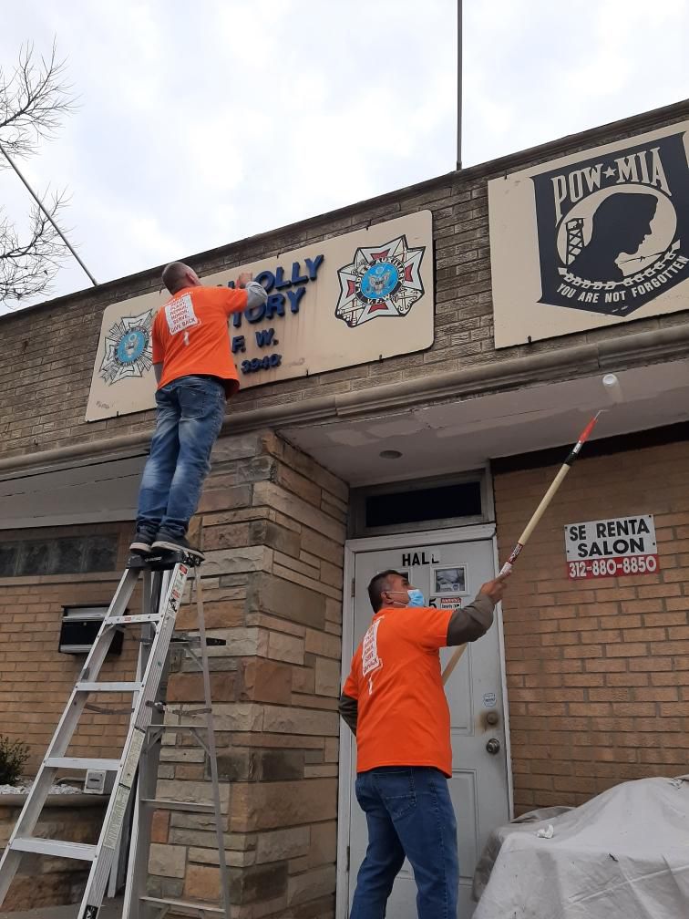 Home Depot volunteers paint and clean the entrance to VFW Station 3940 at 3743 W 63rd St in West Lawn.