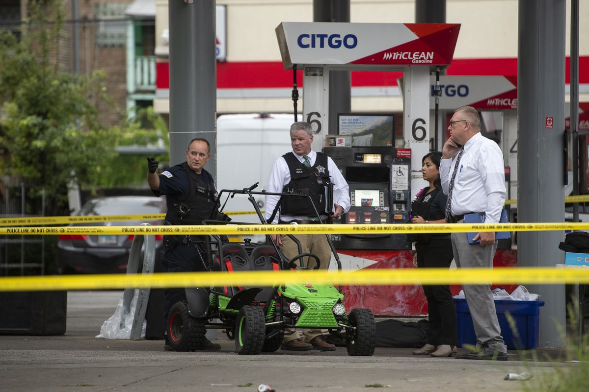 Chicago Police are working on the scene where 3 people were injured in a shooting, including an 11-year-old boy and a 14-year-old girl, outside a Citgo gas station at N. Sacramento Blvd and W. Fulton St. in the East Garfield Park neighborhood, Saturday September 4, 2021. A back-to-school picnic was taking place at the Citgo at the time of the shooting.