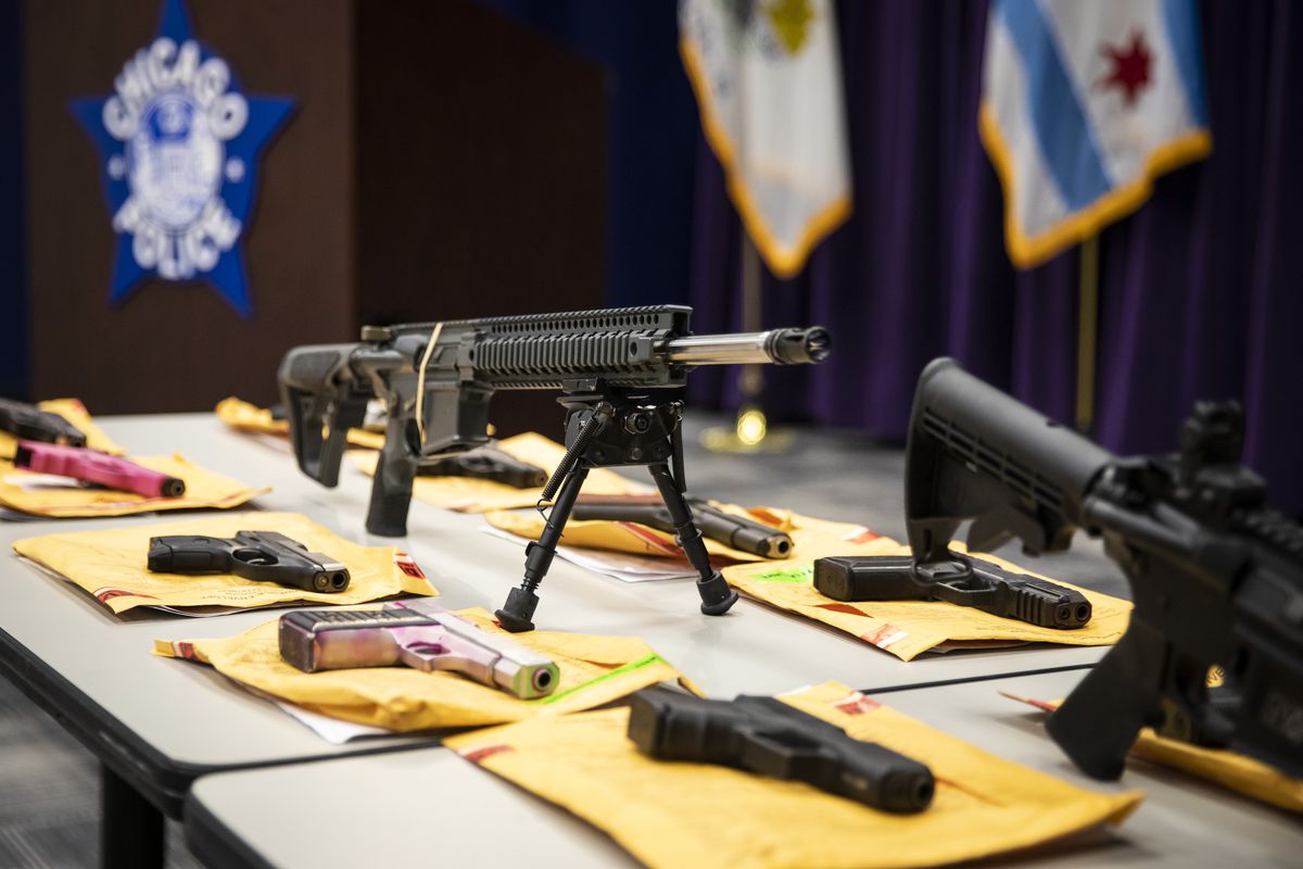 An array of firearms Chicago police said confiscated officers were displayed at a press conference at police headquarters last year. 