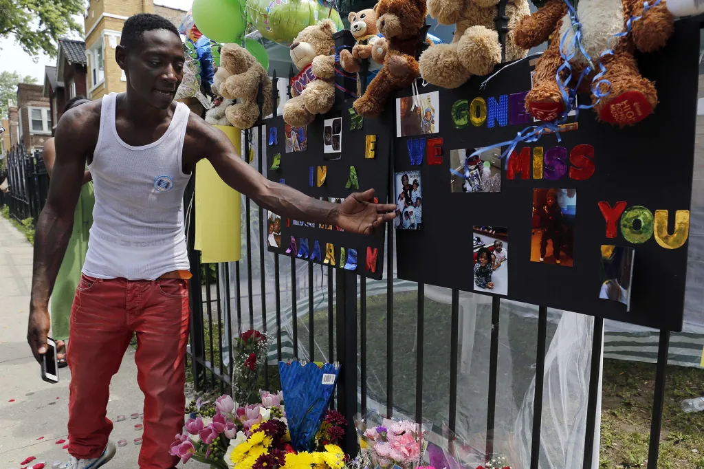 Antonio Brown, father of Amari Brown, is seen near a sign honoring his son after his death in 2015.